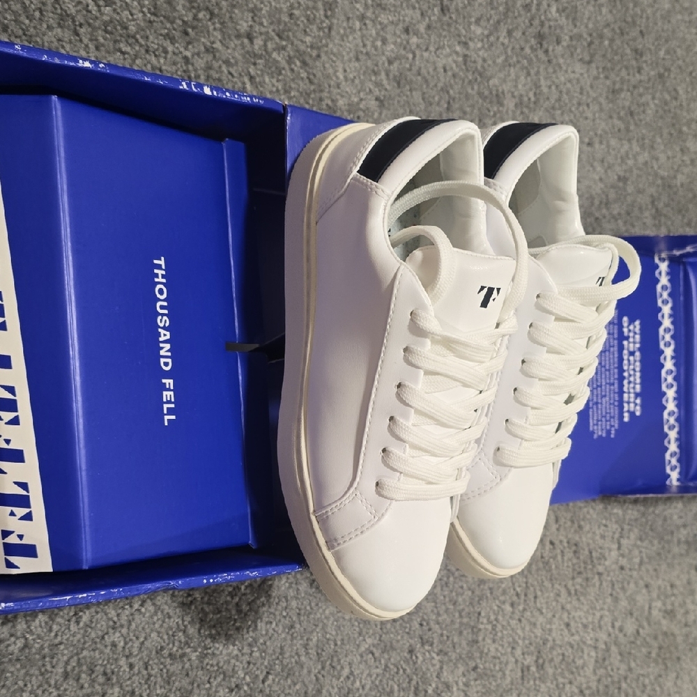 Thousand Fell White Sneakers with Black Accent